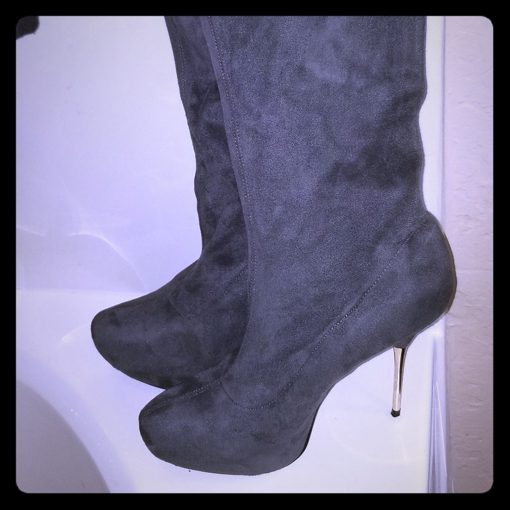 Knee high heeled boots